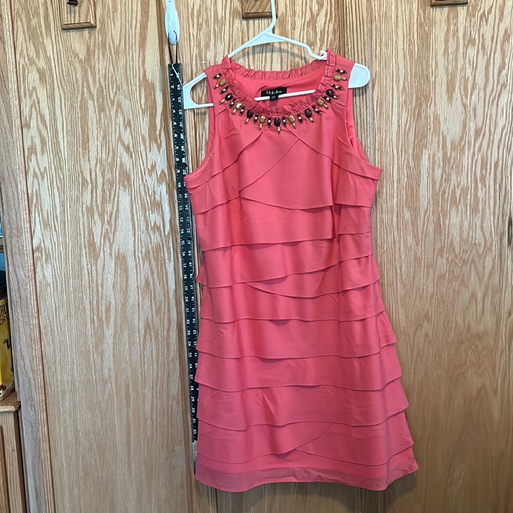 Summer dress. Size 14 petite. Coral with wood beading at the neck. Cotton/Poly